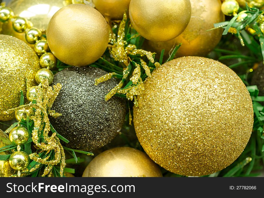 Golden Christmas balls and fir tree.