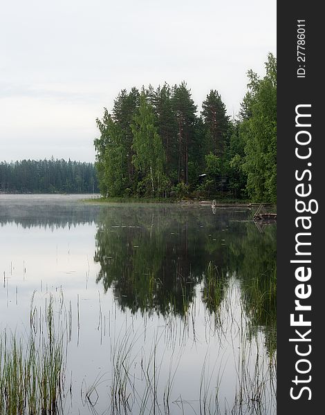 Reflection of forest in a lake in Finnish countryside