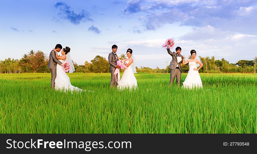 Wedding couple hugging, with a bouquet of flowers. Wedding couple hugging, with a bouquet of flowers