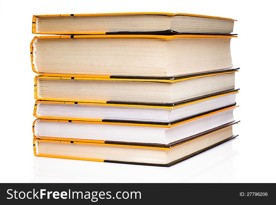 Big stack of yellow books  on white background. Big stack of yellow books  on white background