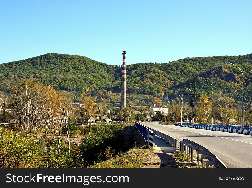 Autumn landscape of a city in mountain area. Autumn landscape of a city in mountain area