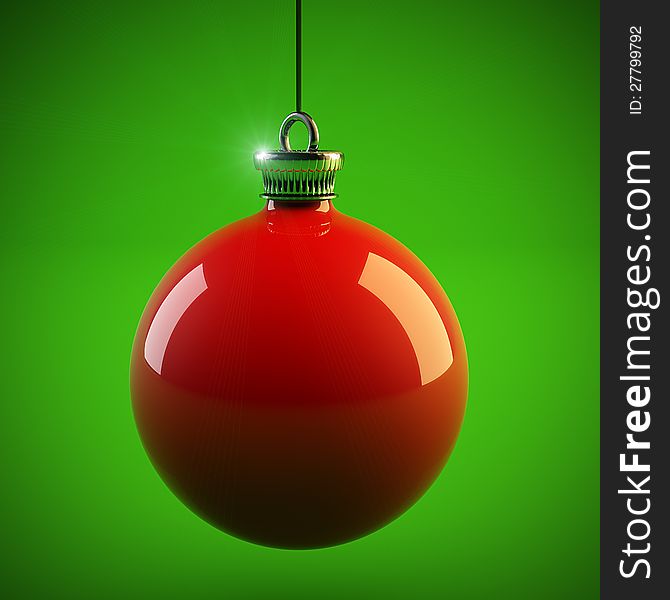 Red Christmas ball hangs over green background