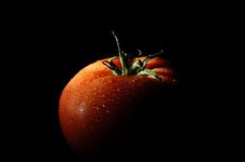 Refreshing Tomato On Black Stock Photo Refreshing Tomato On Black Stock Photo
