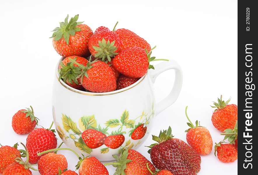 Strawberries in the small pot on white background. Strawberries in the small pot on white background