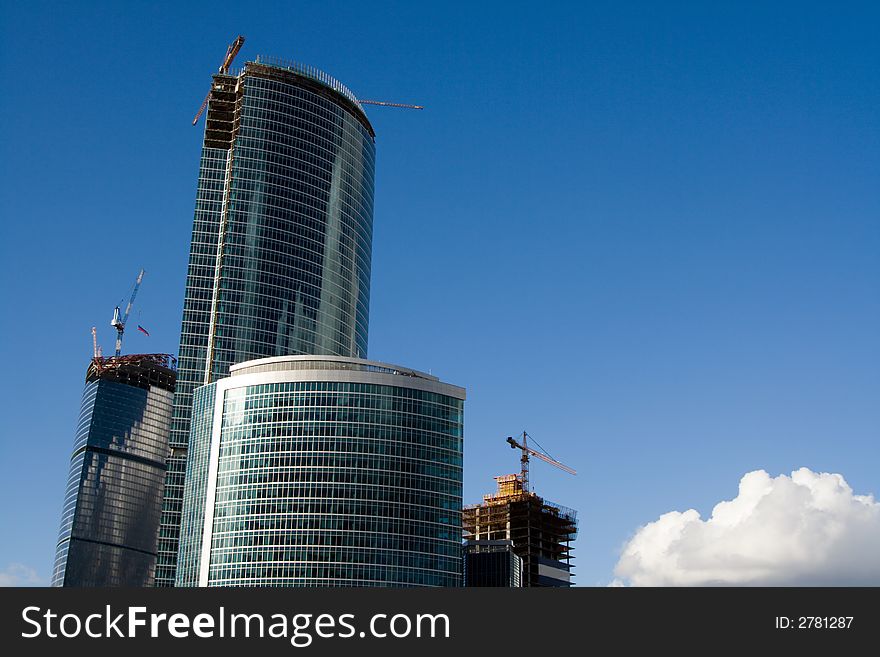 Blue sky at sunset in city and buildings under construction.