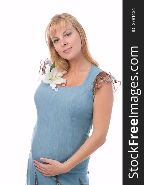 The fine pregnant woman with a flowers. The fine pregnant woman with a flowers