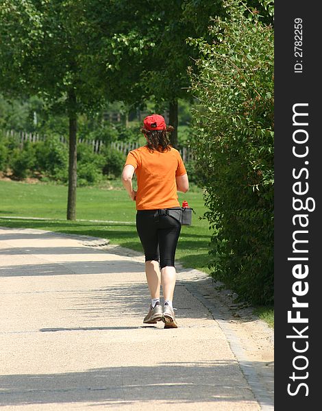 Woman practising footing in a park. Woman practising footing in a park