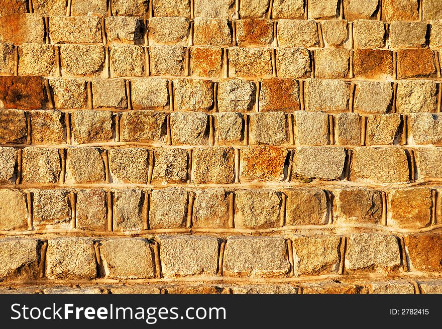 A yellow stone background, a wall. A yellow stone background, a wall.