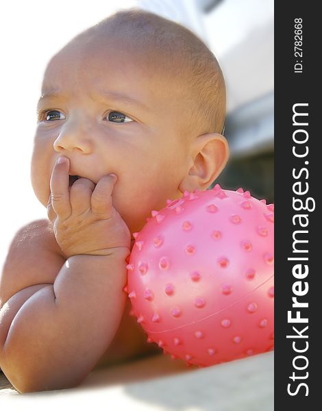 Baby boy portrait with pink ball. Baby boy portrait with pink ball