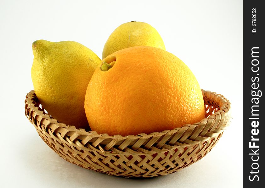 Citruses and orange on the white background