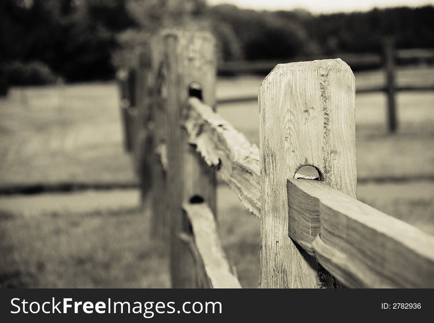 Old country rugged wooden fence. Old country rugged wooden fence