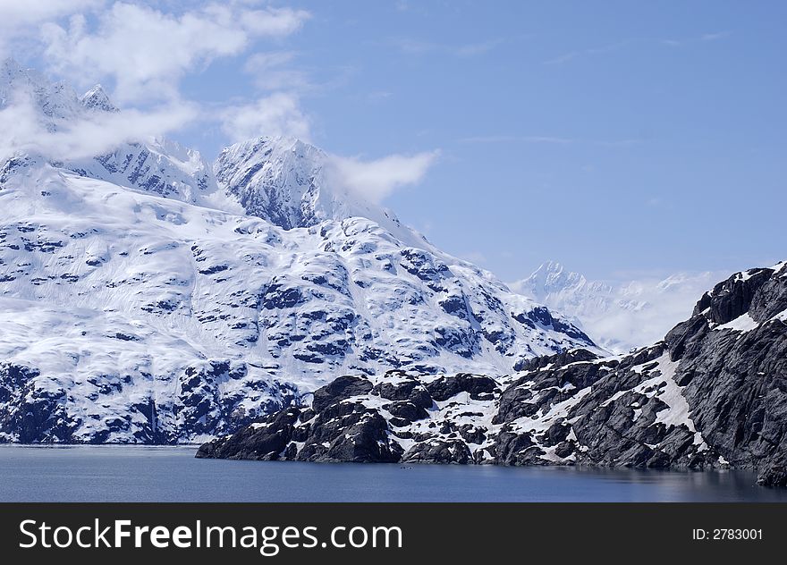 Snow-covered mountain range in Glacier Bay national park, Alaska.