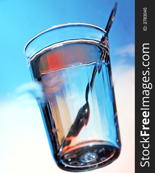 Glass of water on a blue background. Glass of water on a blue background