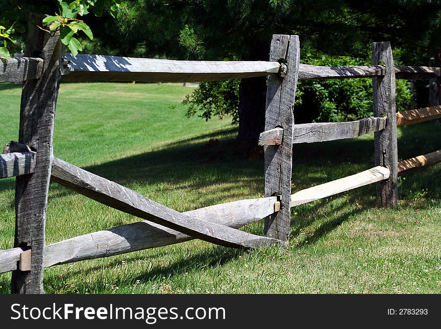 An image of a Broken Wooden Rail Fence