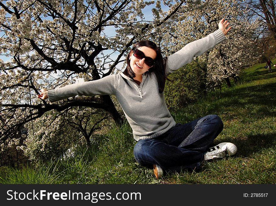 Portrait of a brunette nice girl in a park.