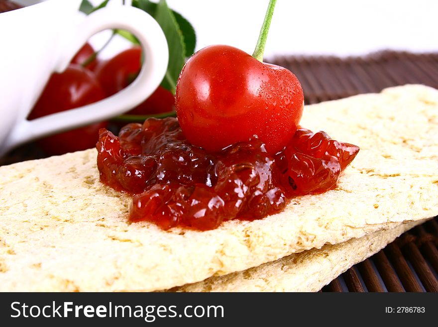 Red cherry jam isolated on white -brown. Red cherry jam isolated on white -brown