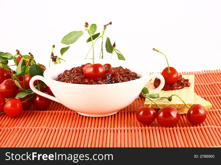 Red cherry jam isolated on white -brown. Red cherry jam isolated on white -brown