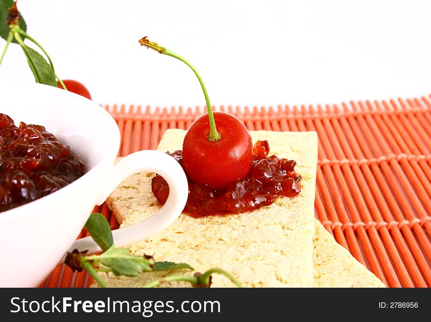 Red cherry jam isolated on white -brown. Red cherry jam isolated on white -brown