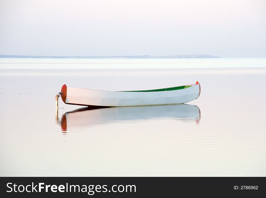 Canoe reflecting in the water