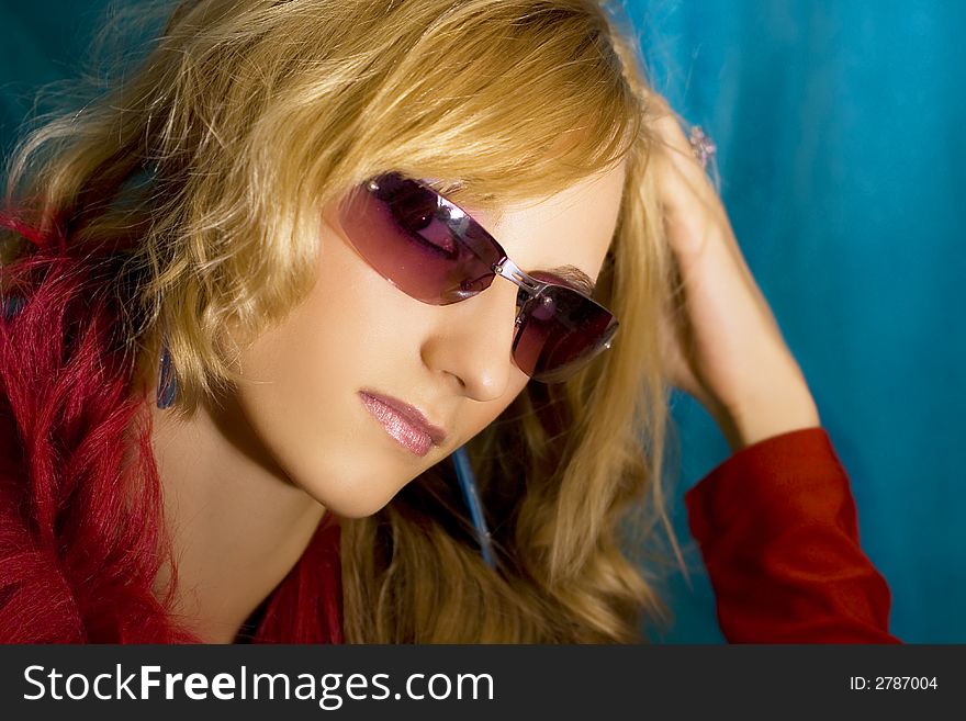 Portrait of young beautiful  blond girl in sun glasses