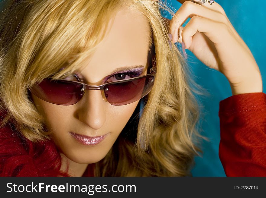 Portrait of young beautiful  blond girl in sun glasses