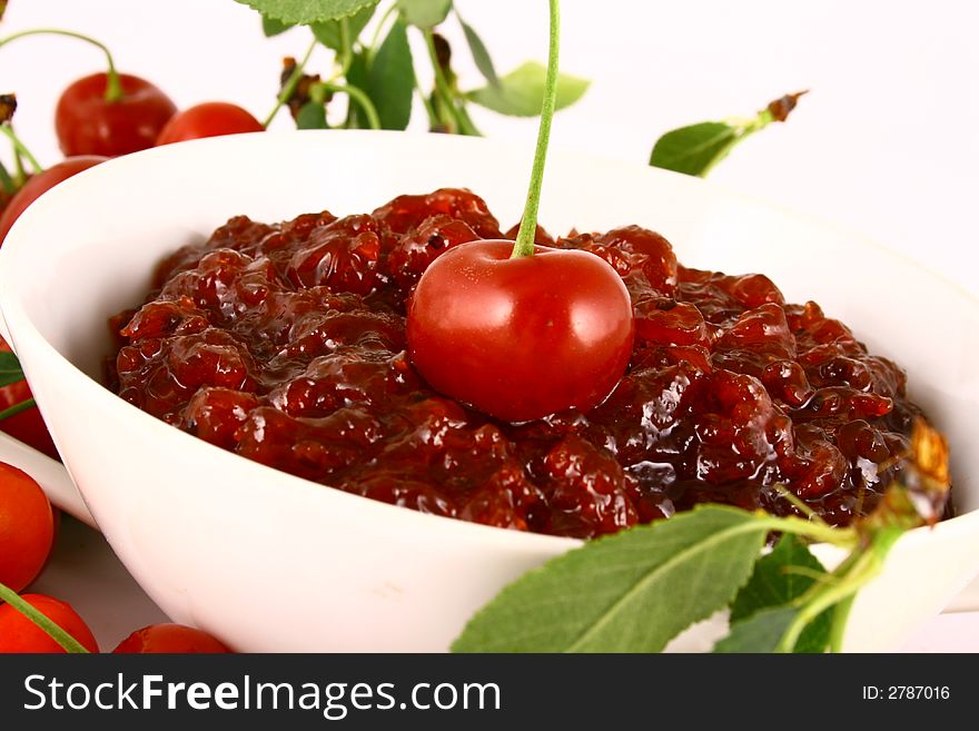 Red cherry jam isolated on white -brown. Red cherry jam isolated on white -brown