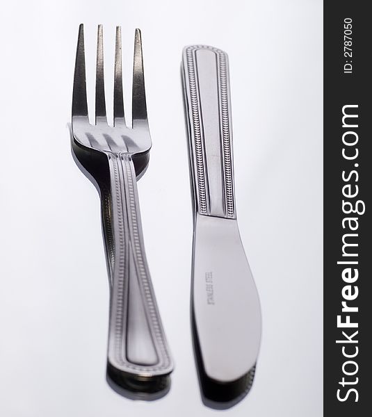 Close up of Knife and fork on white