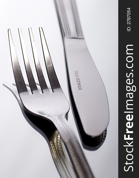 Close up of Knife and fork on white