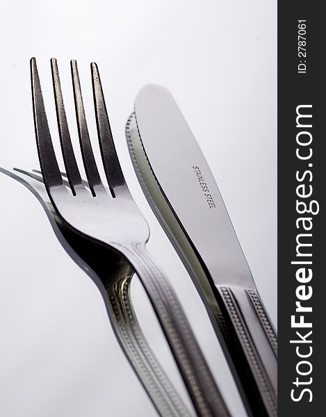 Close up of Knife and fork on white