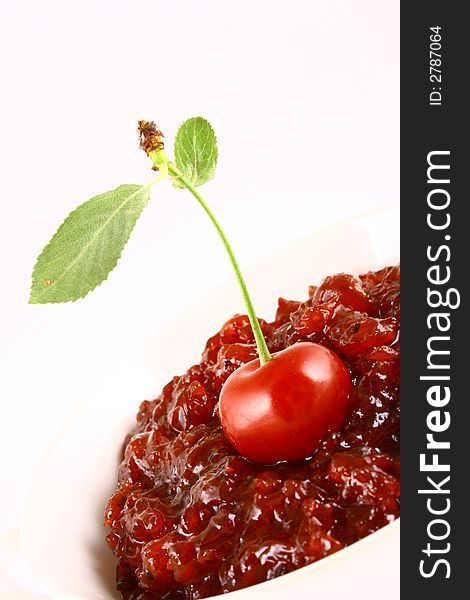 Red cherry jam isolated on white -brown. Red cherry jam isolated on white -brown