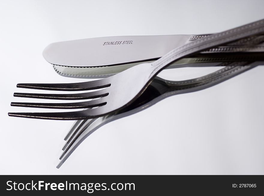 Close up of Knife and fork on white