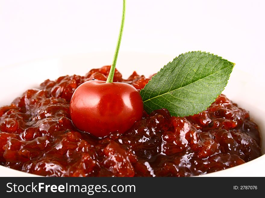 Red cherry jam isolated on white -brown. Red cherry jam isolated on white -brown