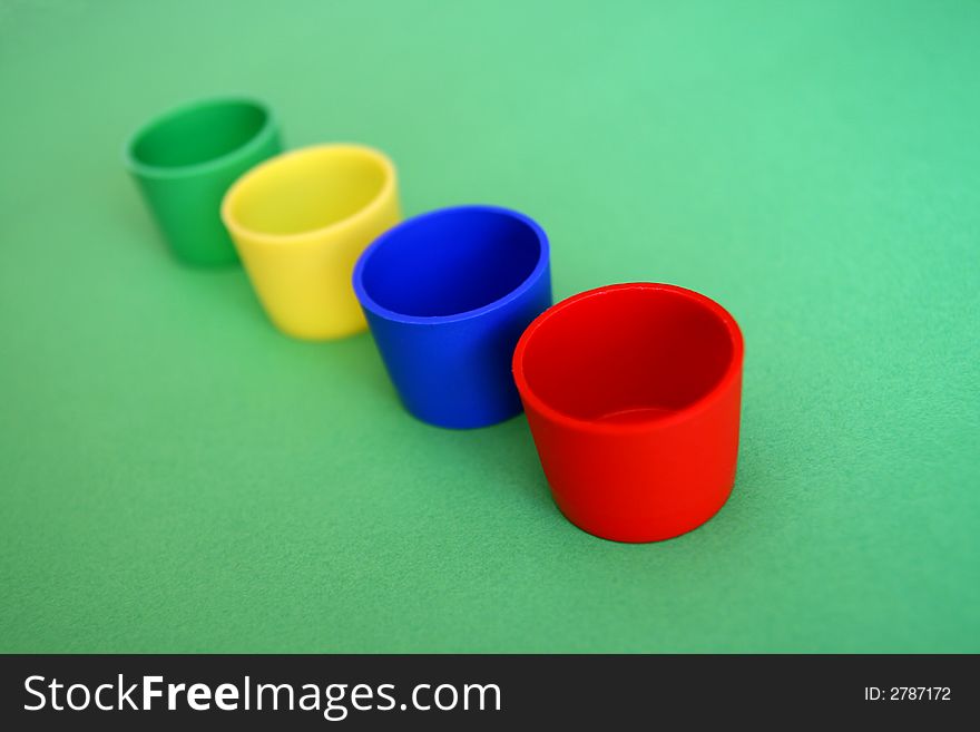 Four colored mug,
blue,green,red,yellow,

selective focus,. Four colored mug,
blue,green,red,yellow,

selective focus,