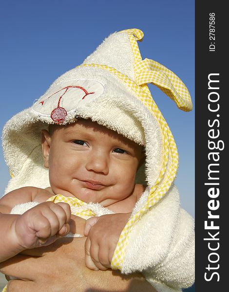 Baby in towel after swimming. Baby in towel after swimming