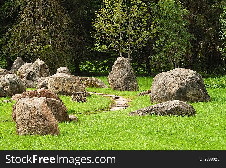 Park with trees and big stones. Park with trees and big stones.