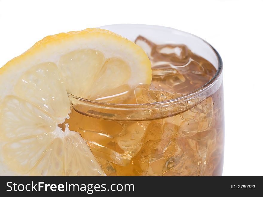 Cold glass of ice tea with lemon slice