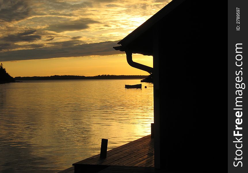 Pier in sunset in the archipelago in Northern Europe. Pier in sunset in the archipelago in Northern Europe