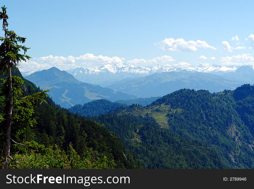 Landscape in Alpes,green Forest  ,Mountains sunshine and small haze
Austria,Kossen, July 2007. Landscape in Alpes,green Forest  ,Mountains sunshine and small haze
Austria,Kossen, July 2007