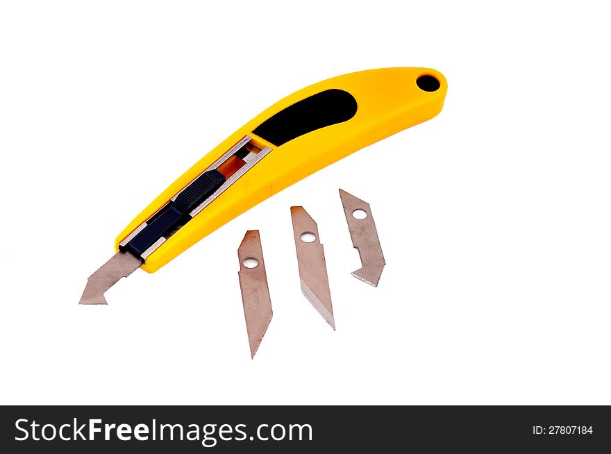 Knife with a yellow handle to work on the cardboard and plastic sheets and spare blades. Knife with a yellow handle to work on the cardboard and plastic sheets and spare blades
