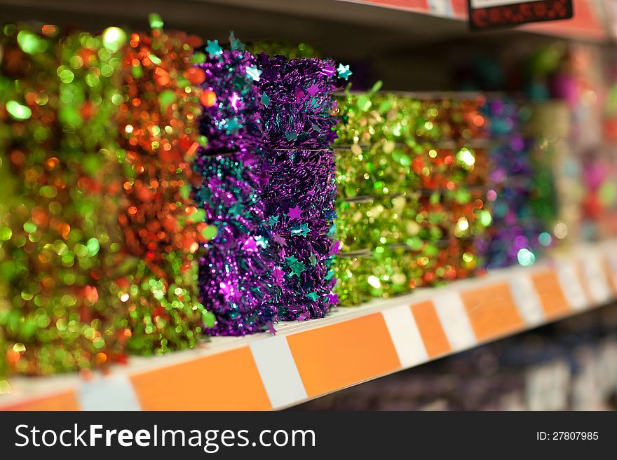 Line of different xmas decor on shelfs in hypermarket. Line of different xmas decor on shelfs in hypermarket