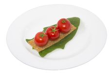 Tomato On Crouton And A Leaf Spinach In A Plate Stock Images