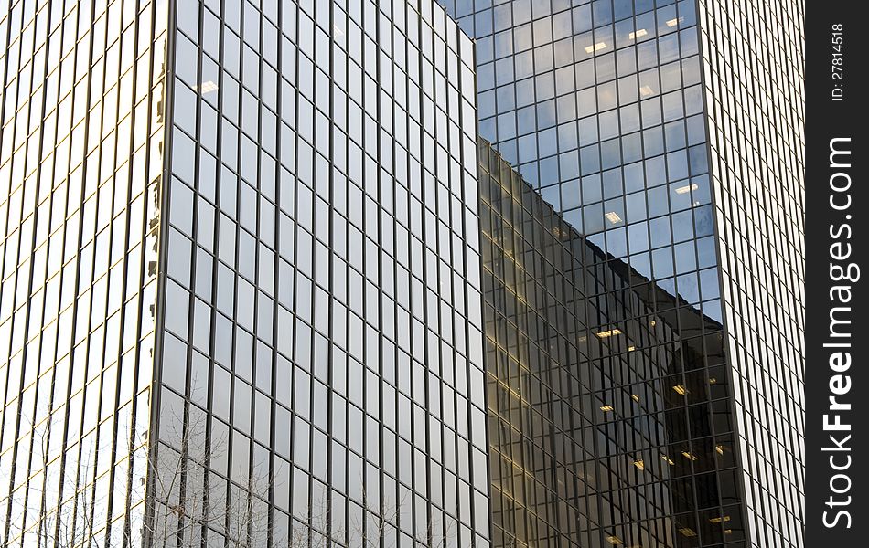 A modern business building with glass walls. A modern business building with glass walls.