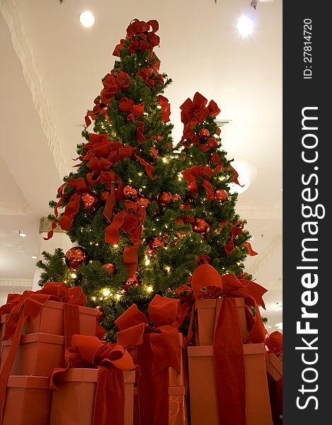 A beautiful Christmas tree with big gift boxes. A beautiful Christmas tree with big gift boxes