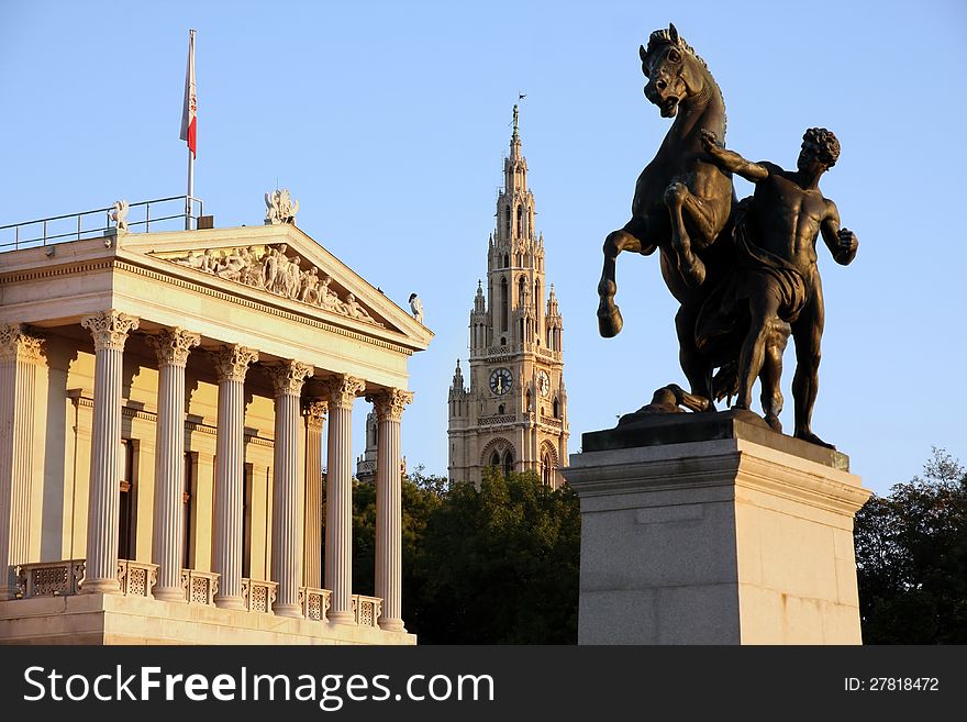 The Austrian Parliament, Statue of man and the horse and Rathaus in Vienna, Austria. The Austrian Parliament, Statue of man and the horse and Rathaus in Vienna, Austria