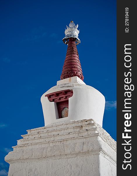 Buddhist stupa over blue sky at Thiksey Gompa. India, Ladakh, Thiksey Monastery