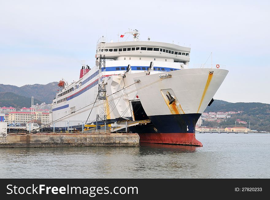 A cruise ship docked at the shore