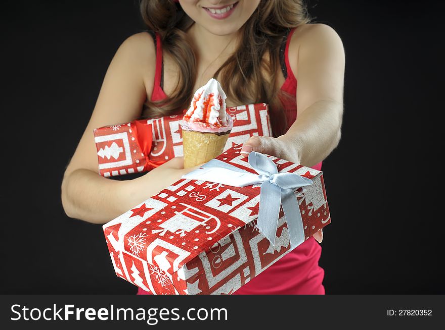 Christmas  Girl  Holds  Gift Boxes And Ice Cream