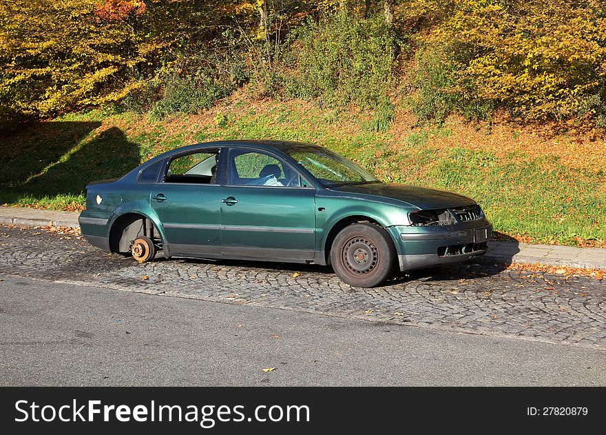 Abandoned car near a highway, with parts that are already stolen by others. Abandoned car near a highway, with parts that are already stolen by others.