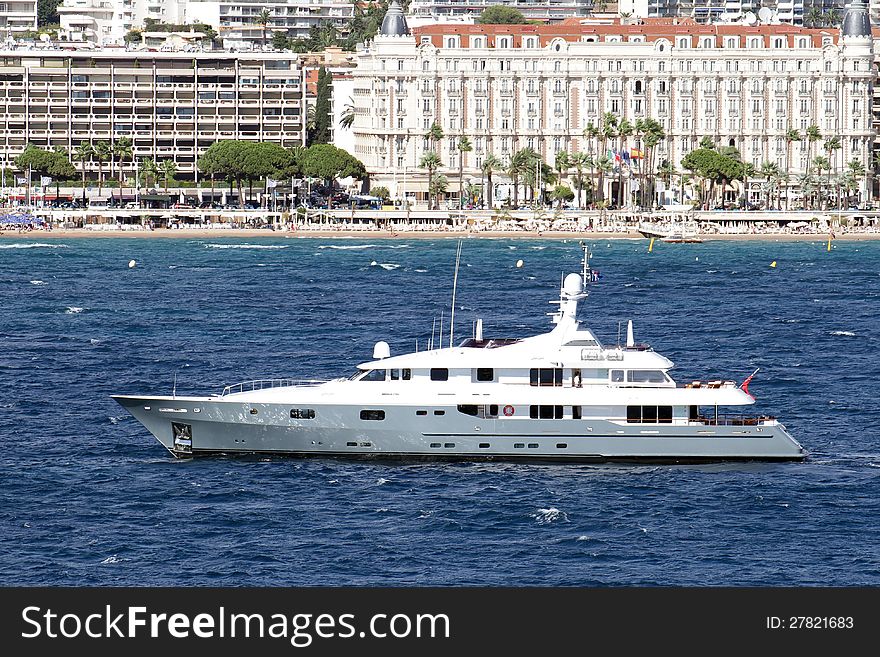 Luxury private yacht sailing close to Cannes port in France. Luxury private yacht sailing close to Cannes port in France.