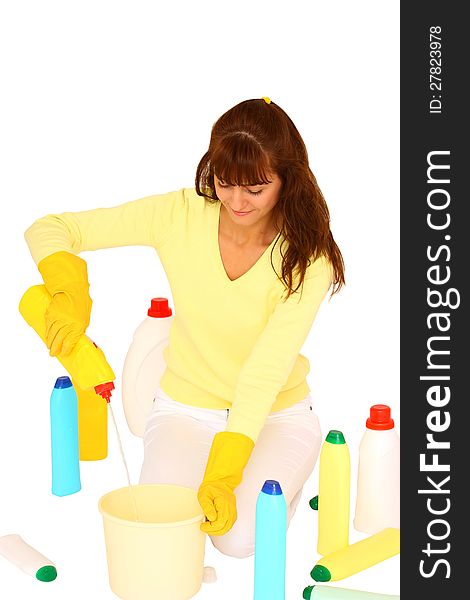 Woman preparing to clean using plastic bottles and bucket isolated on a white background. Woman preparing to clean using plastic bottles and bucket isolated on a white background